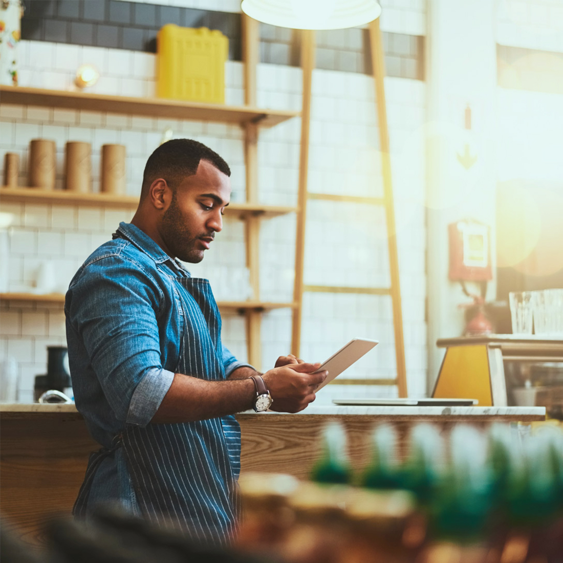 Shop owner working on tablet
